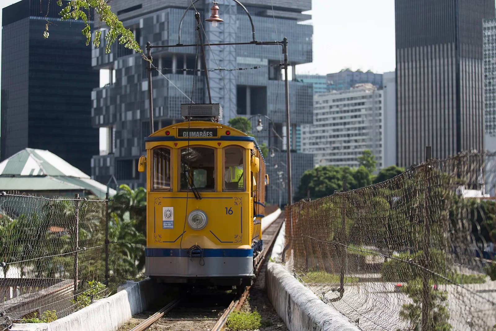 The yellow Santa Teresa tram on its tracks