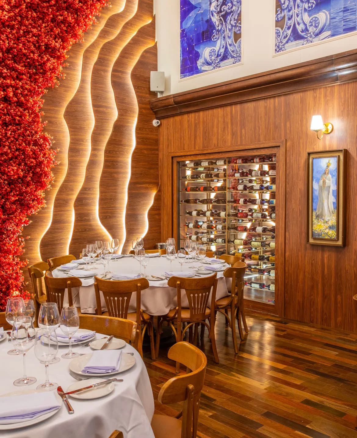 Dining room at Gajos d'Ouro with azulejo tiles and a wine wall