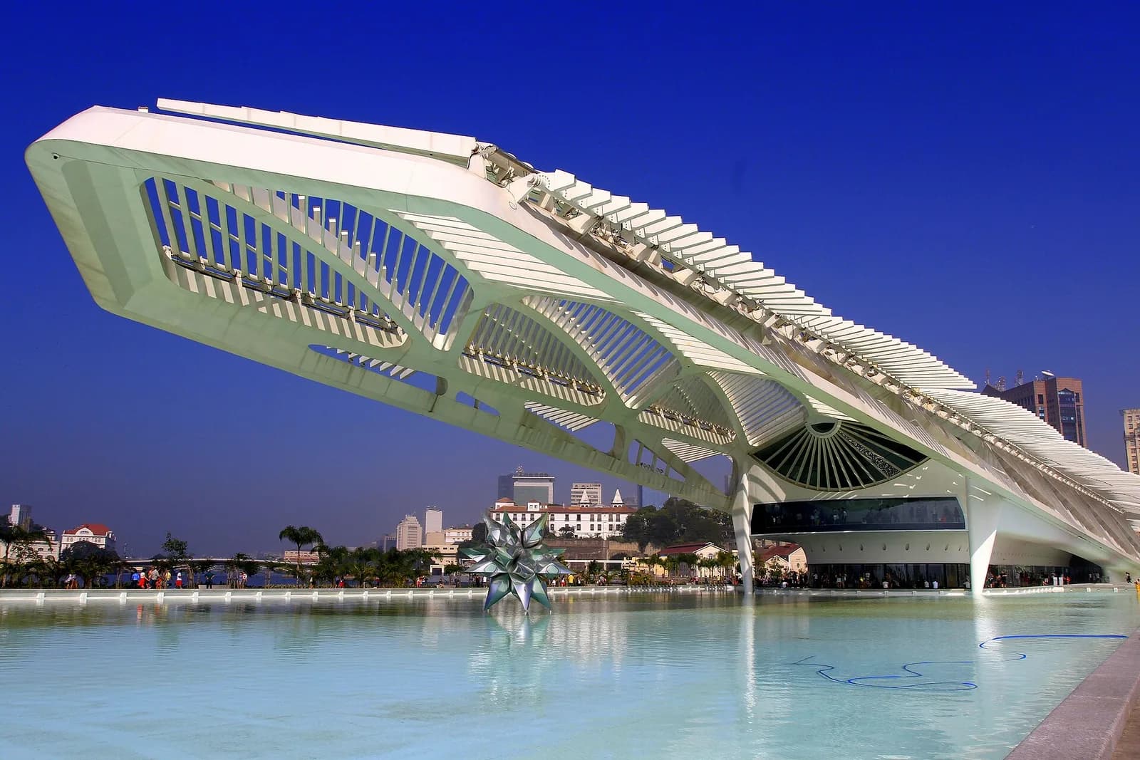 The winged structure of the Museu do Amanhã over its reflecting pool